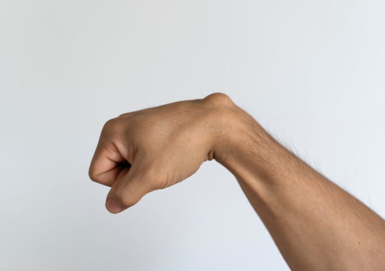 Ganglion cyst on man's hand on white background