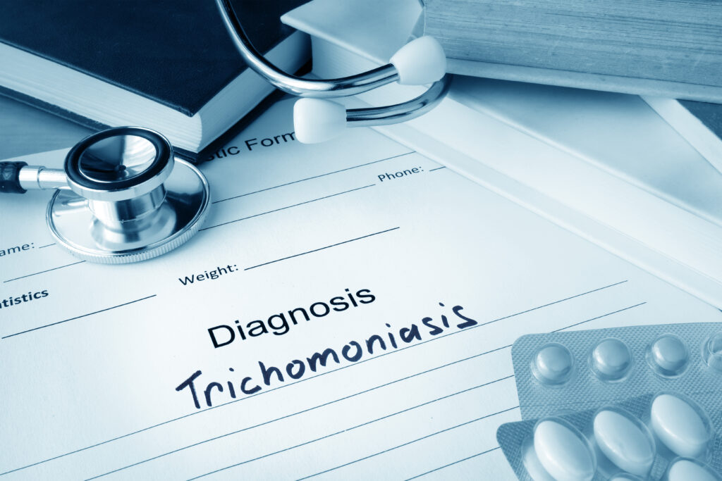 Diagnostic form with diagnosis Trichomoniasis and pills.